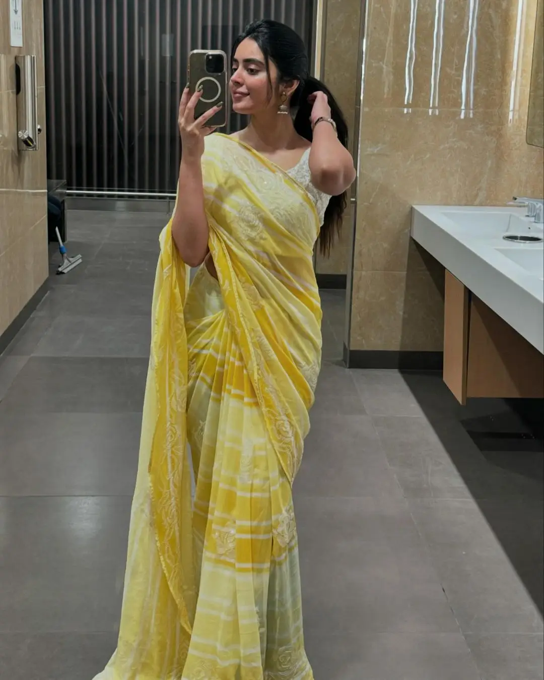 Kushita Kallapu In Traditional Yellow Saree White Blouse